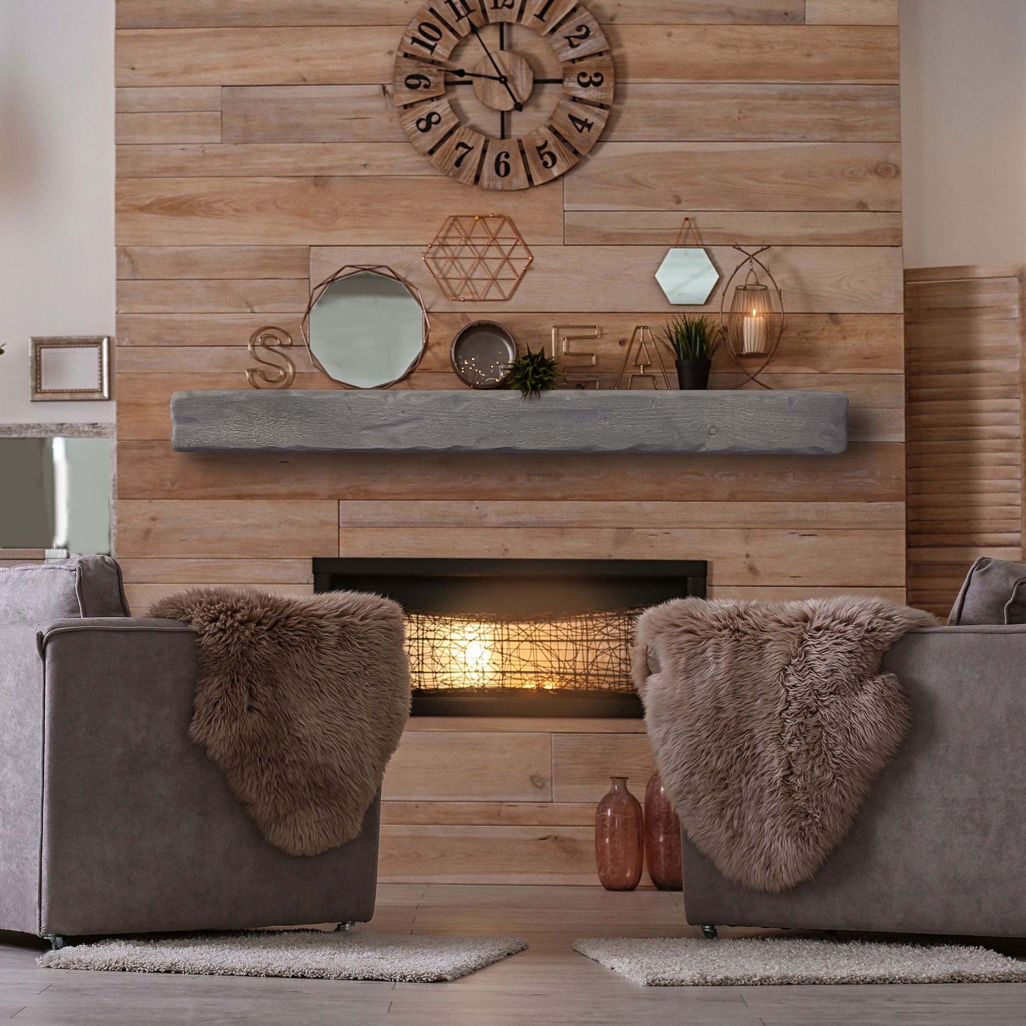 A grey rustic floating matel installed on a reclaimed wood wall. 