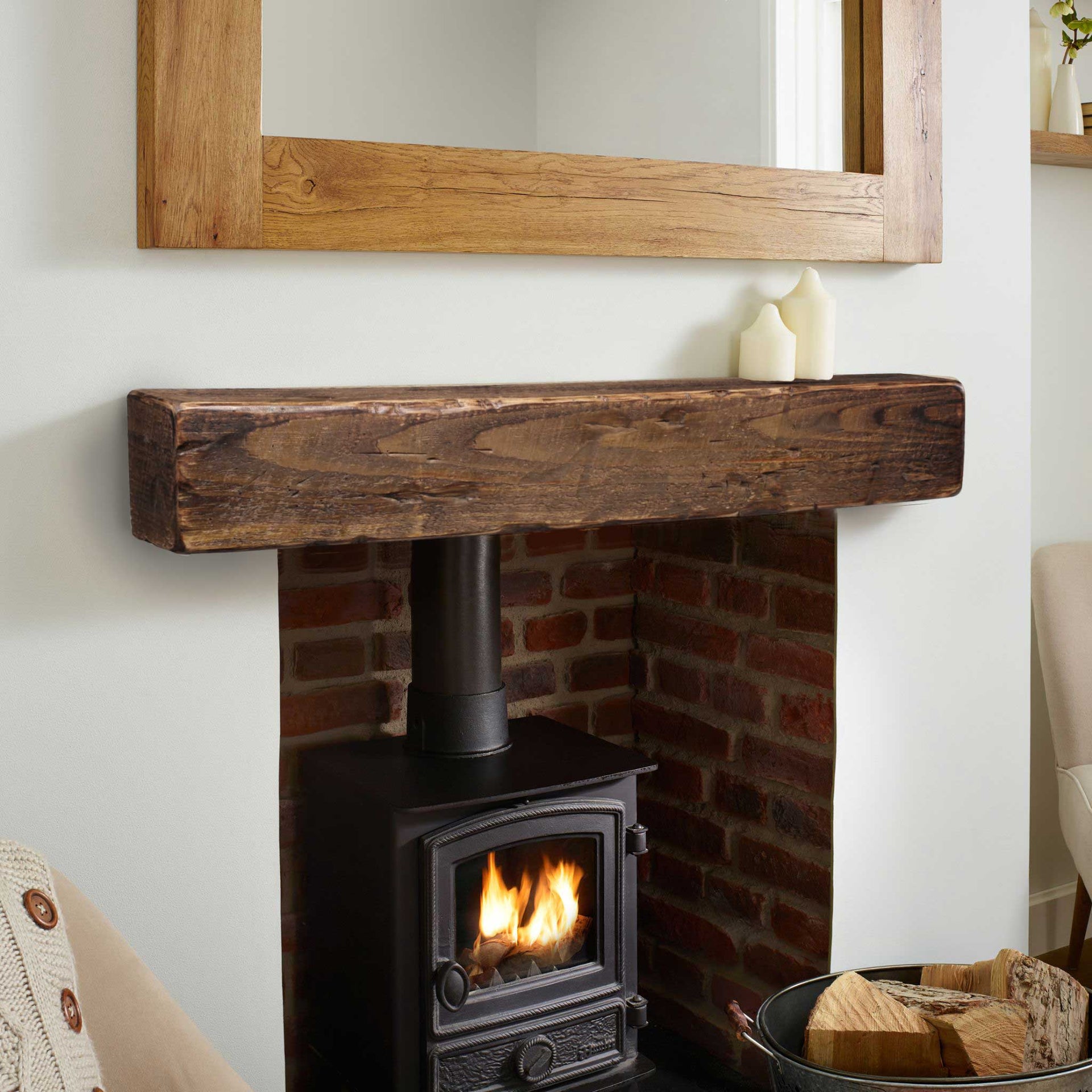 A Rustic floating mantel above a wood burning stove fireplace insert 